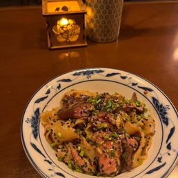 Astoria DC signature dishes Dan Dan Noodles, Dry-Fried Chicken Wings, Mapo Tofu, Pork and Chive Dumplings in Chili Oil